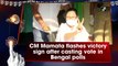 West Bengal CM Mamata Banerjee flashes victory sign after casting vote in Assembly polls