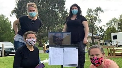 Healthcare workers drop medical equipment and turn to the stage