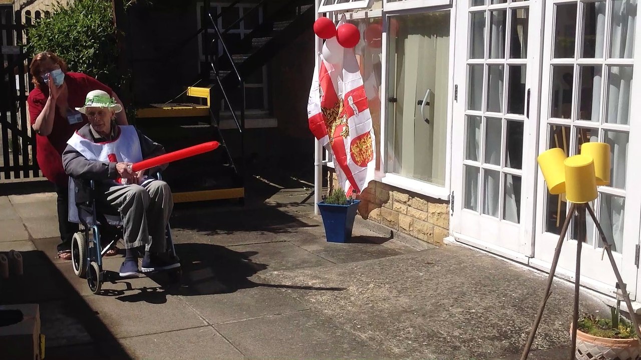 Wheelchair jousting by staff and residents at Five Bells care home in