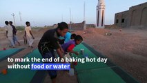 Shrugging off economic woes, Sudanese share Ramadan meal
