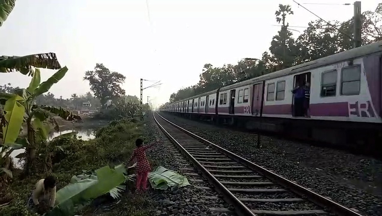 The little girl waving her hands by saying 'HELLO' to the passenger