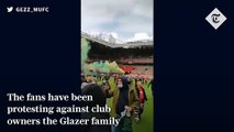 Manchester United fans break onto Old Trafford pitch in anti-Glazers protest