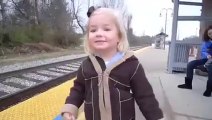 Baby girl first time see the train