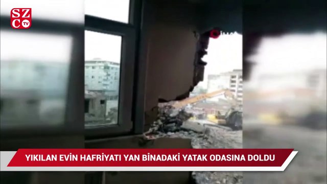 Yıkılan binanın hafriyatı yan binadaki evin yatak odasına doldu