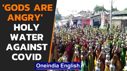 Gujarat: Women gather to offer water in a temple to 'stop Covid-19' | Oneindia News