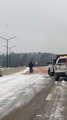Salting a Snowy Bridge in Mississippi