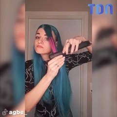 Elle essaye de se teindre les cheveux en mettant du parfum sur un fer à lisser !