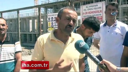 Maaş alamayan işçiler vincin üzerine çıktı