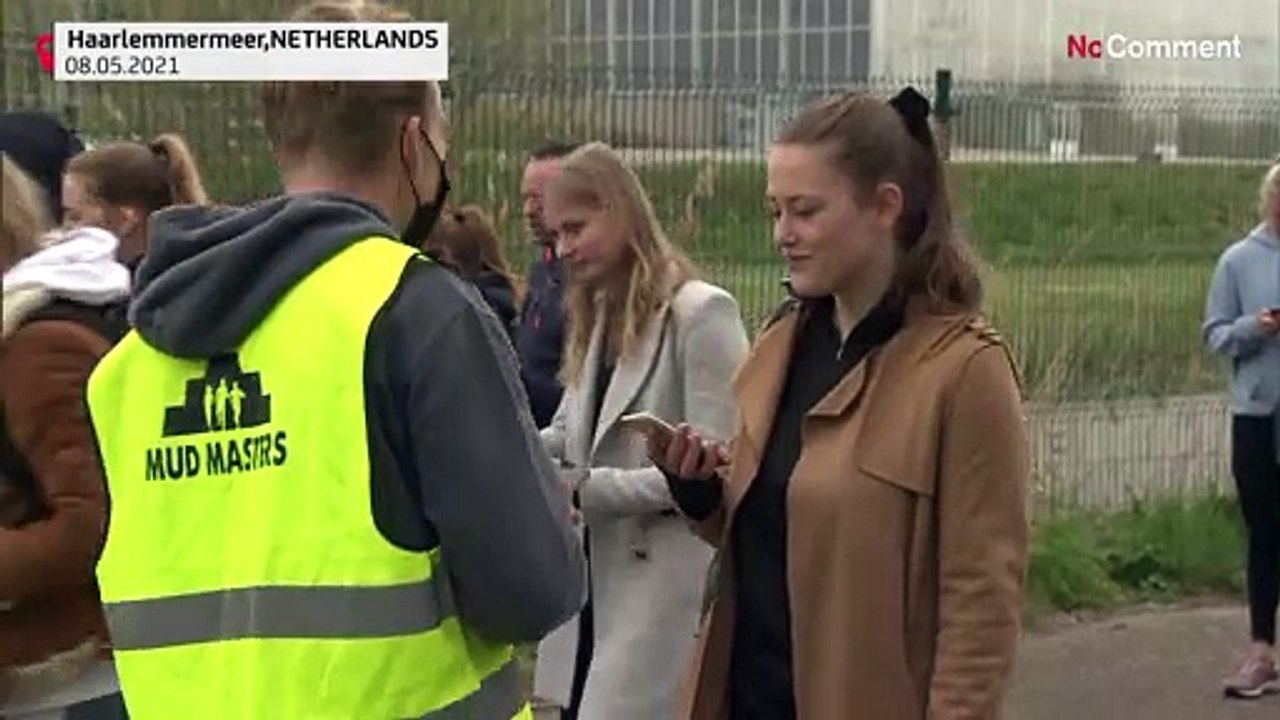 Enthusiasts crawl over muddy course full of obstacles testing corona proof events
