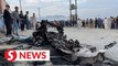 Afghan school blast toll rises to 58, families bury victims