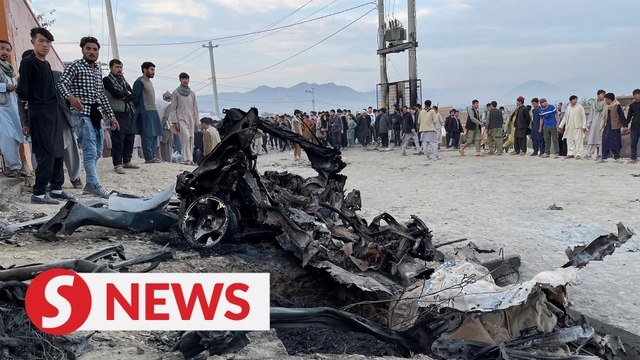 Afghan school blast toll rises to 58, families bury victims