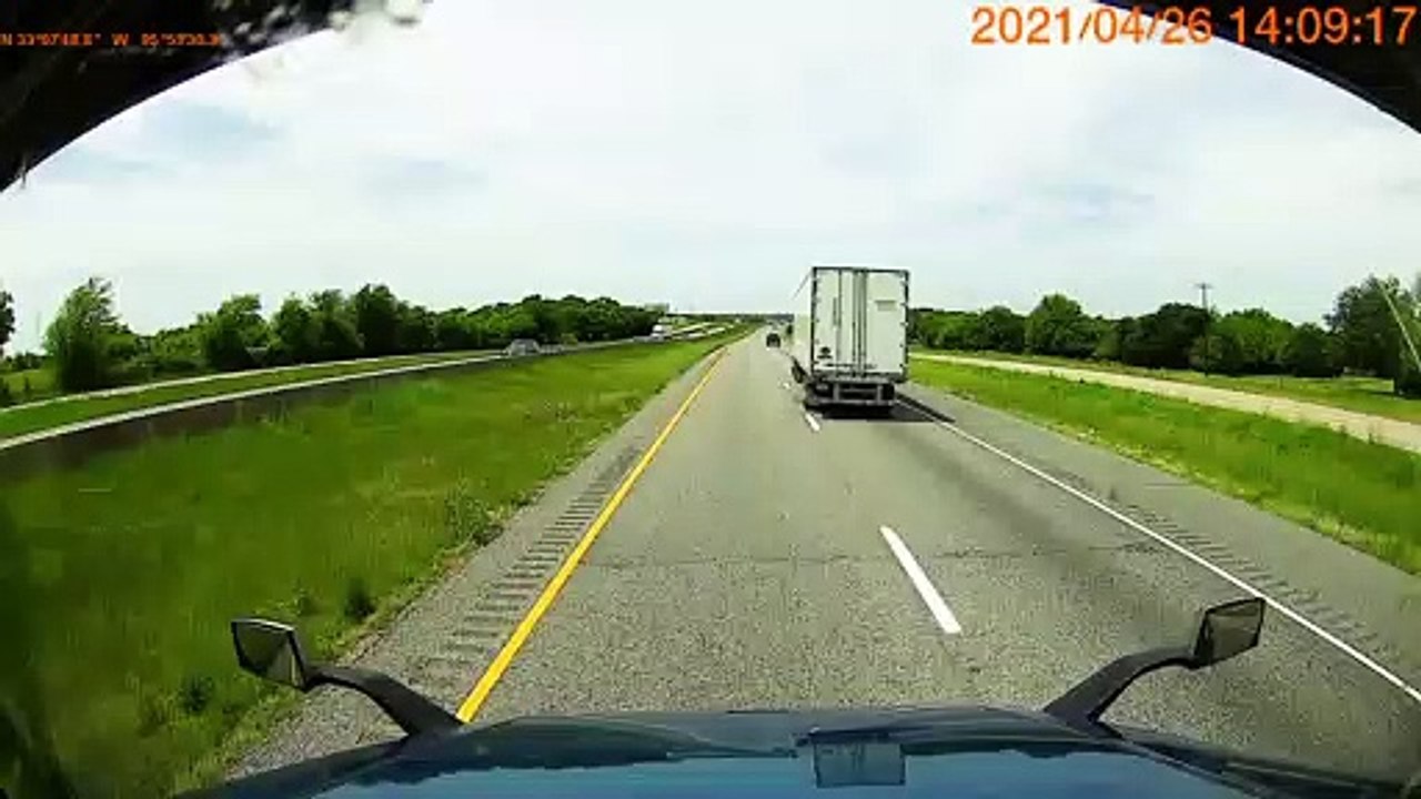 Truck Tips Into Ditch on Interstate