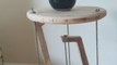 Person Balances Table Over Thin Ropes by Applying Physics Principle of Tensegrity to it