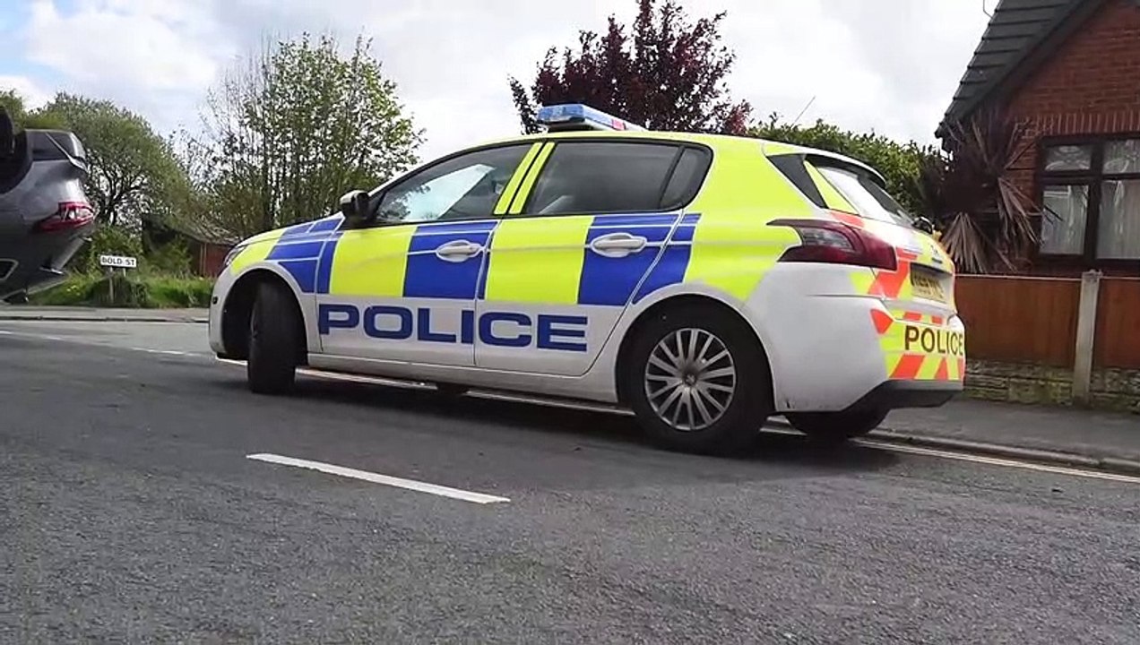 Police at scene of overturned car