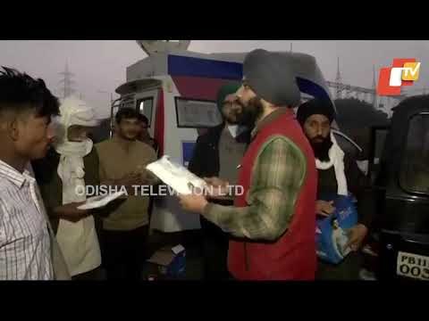 NRI Brothers Distribute Winter Garments To Protesting Farmers At Ghazipur Border
