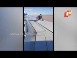 Youth Climbs Atop Airplane's Wing In USA, Arrested