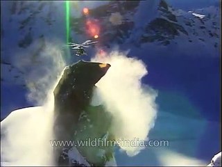 Close-up of a helicopter hovering over a Himalayan peak