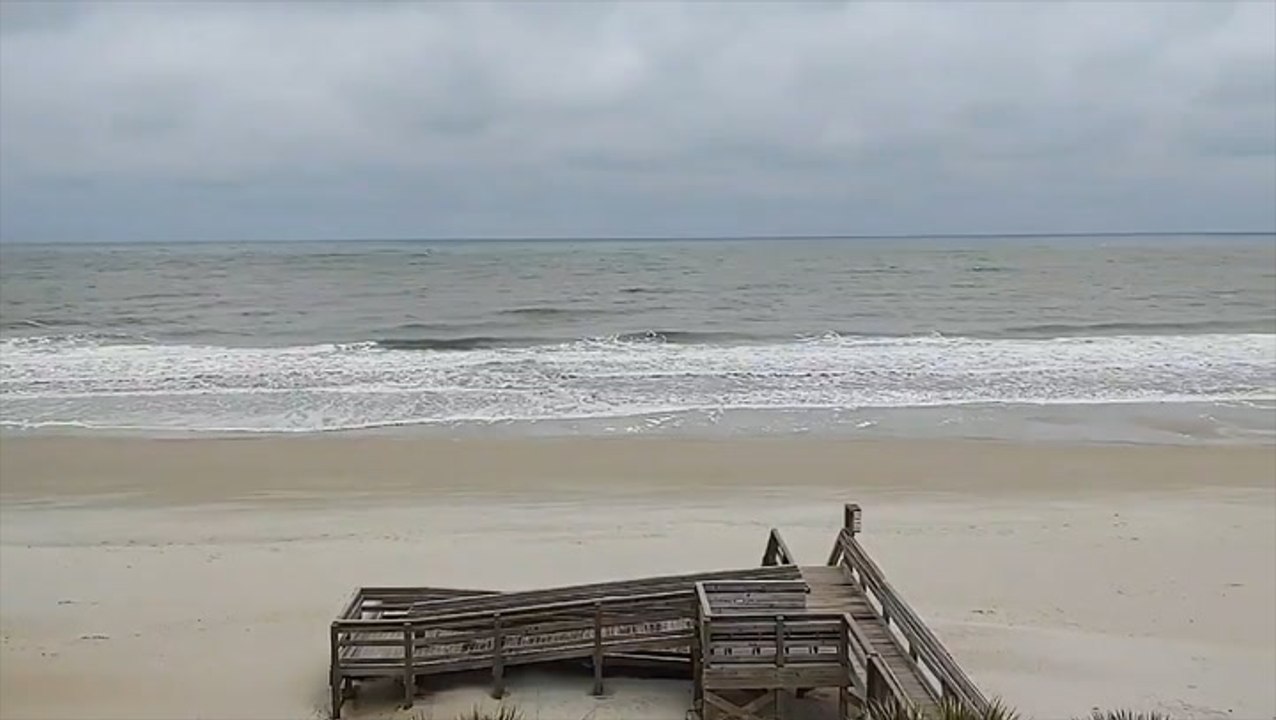 Gray skies hang over the beach