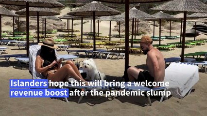 Tourists soak up the sun in Crete as Greece's tourist season kicks off