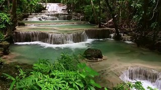 Majestic Waterfall In Tropical Forest Of Thailand