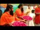 Yoga Guru Baba Ramdev & Acharya Balkrishna Celebrate Holi Showering Flower Petals