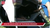 Sıkıştığı ters dönen aracın içinde cep telefonunu elinden bırakmadı
