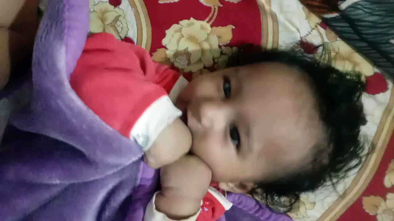 Cute baby playing with himself, very cute expression