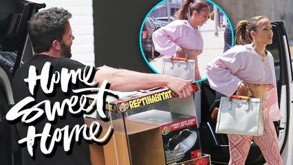 JLo looks fresh and fit in a cut off pink sweater while Ben keeps busy in his new home