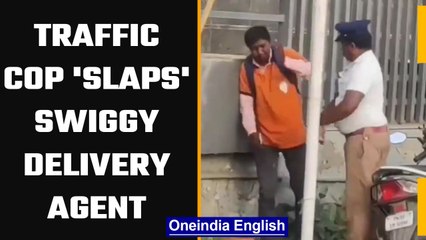 Tải video: Traffic cop purportedly slaps Swiggy delivery agent, transferred on complaint | OneIndia News #News