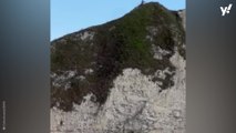 Heart-stopping moment tourist slips on cliff edge above 120ft drop