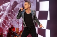 Robbie Williams covers 90s rivals Oasis at his homecoming concert