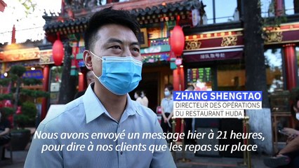 Covid: les Pékinois fêtent la réouverture des restaurants