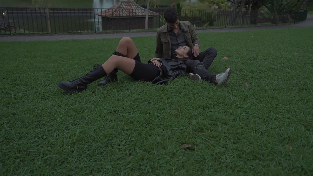 A guy gently stroking his girlfriend’s hair