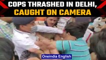 Delhi: Traffic police cop thrashed by locals in Sangam Vihar, Watch | Oneindia News *News