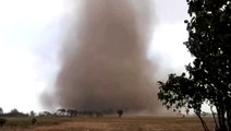 Tornado spews dirt and dust