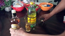 Ron Añejo almirante con agua mineral topo chico vaso con hielo refrescante y deliciosa bebida tradicional ancestral cuba recomendable para el calor