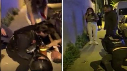 Sokak ortasında dayak yiyen kadın motosikletli grup tarafından kurtarıldı