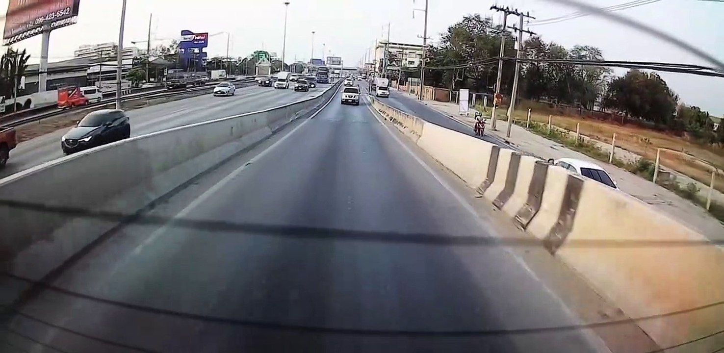 Moped with Two Passengers Goes for a Slide