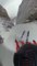 Guy Skis Down Steep Mountain Slope at High Speed