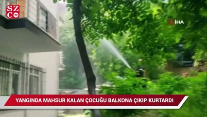 Yangında mahsur kalan çocuğu balkona tırmanıp kurtardılar