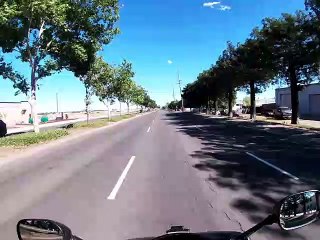 Motorcycle Rider Slides Along the Street After Attempted Wheelie