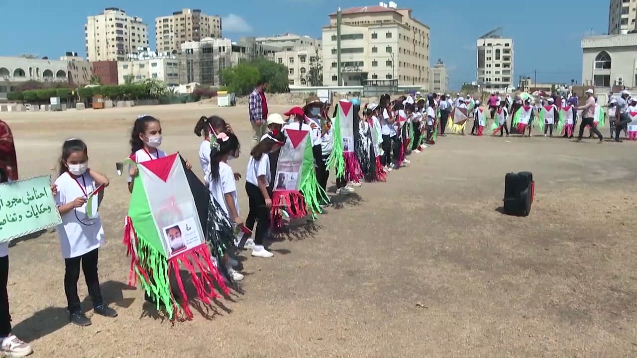 Gaza children fly kites with portraits of kids killed in last conflict with Israel
