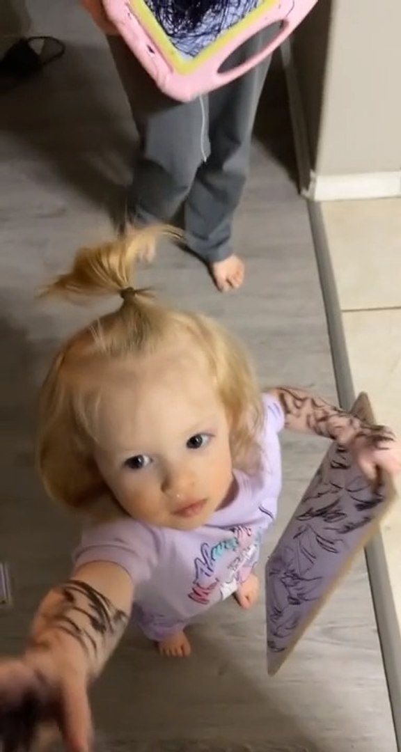 Little Girl Uses Marker And Scribbles On Herself And Things Around Her