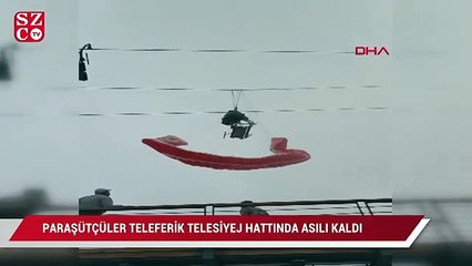 Скачать видео: Paraşütçüler teleferik telesiyej hattında asılı kaldılar