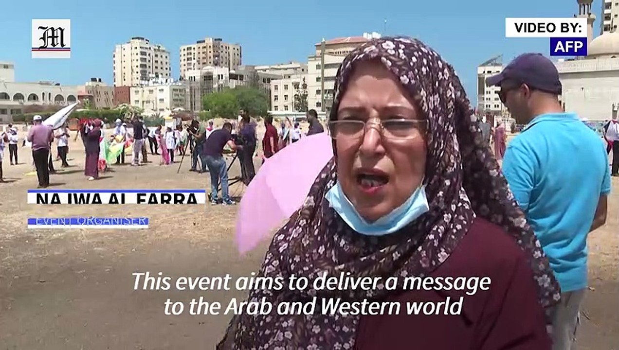 Gaza children fly kites with portraits of kids killed in last conflict with Israel