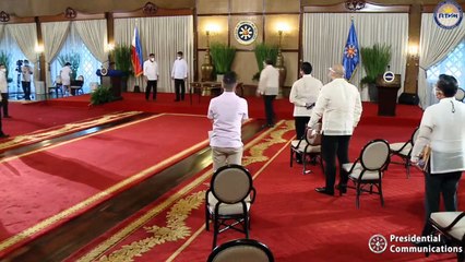President Rodrigo Roa Duterte leads the re-enactment of the signing of several bills
