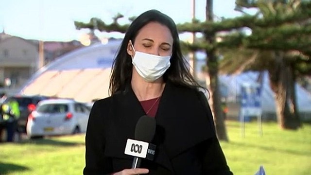 NSW authorities race to find source of two local COVID infections