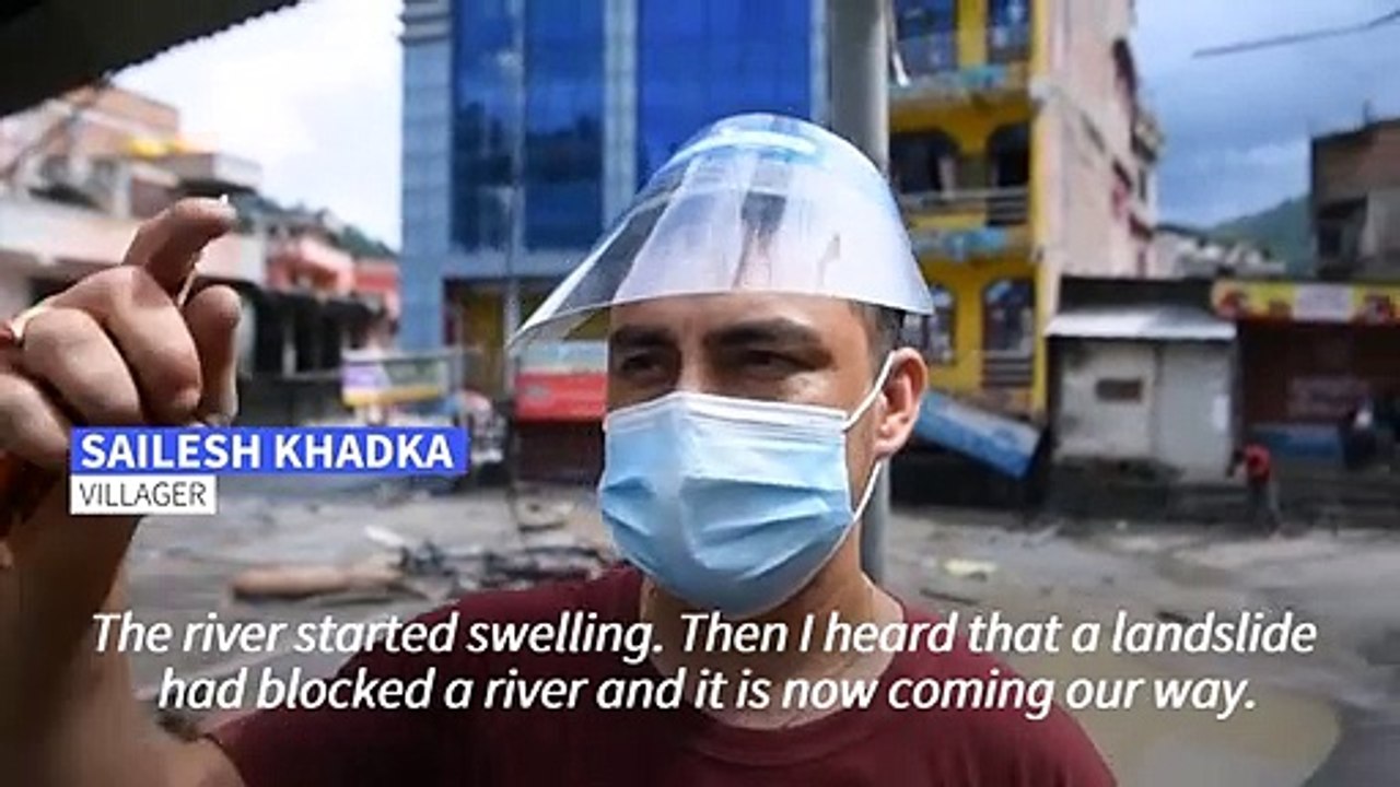 Rescuers at deadly Nepal flood as waters swirl through houses