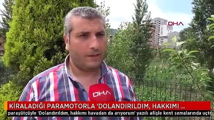 KİRALADIĞI PARAMOTORLA 'DOLANDIRILDIM, HAKKIMI ARIYORUM' YAZILI AFİŞLE UÇTU