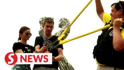 Ukraine's handcuffed couple parts ways